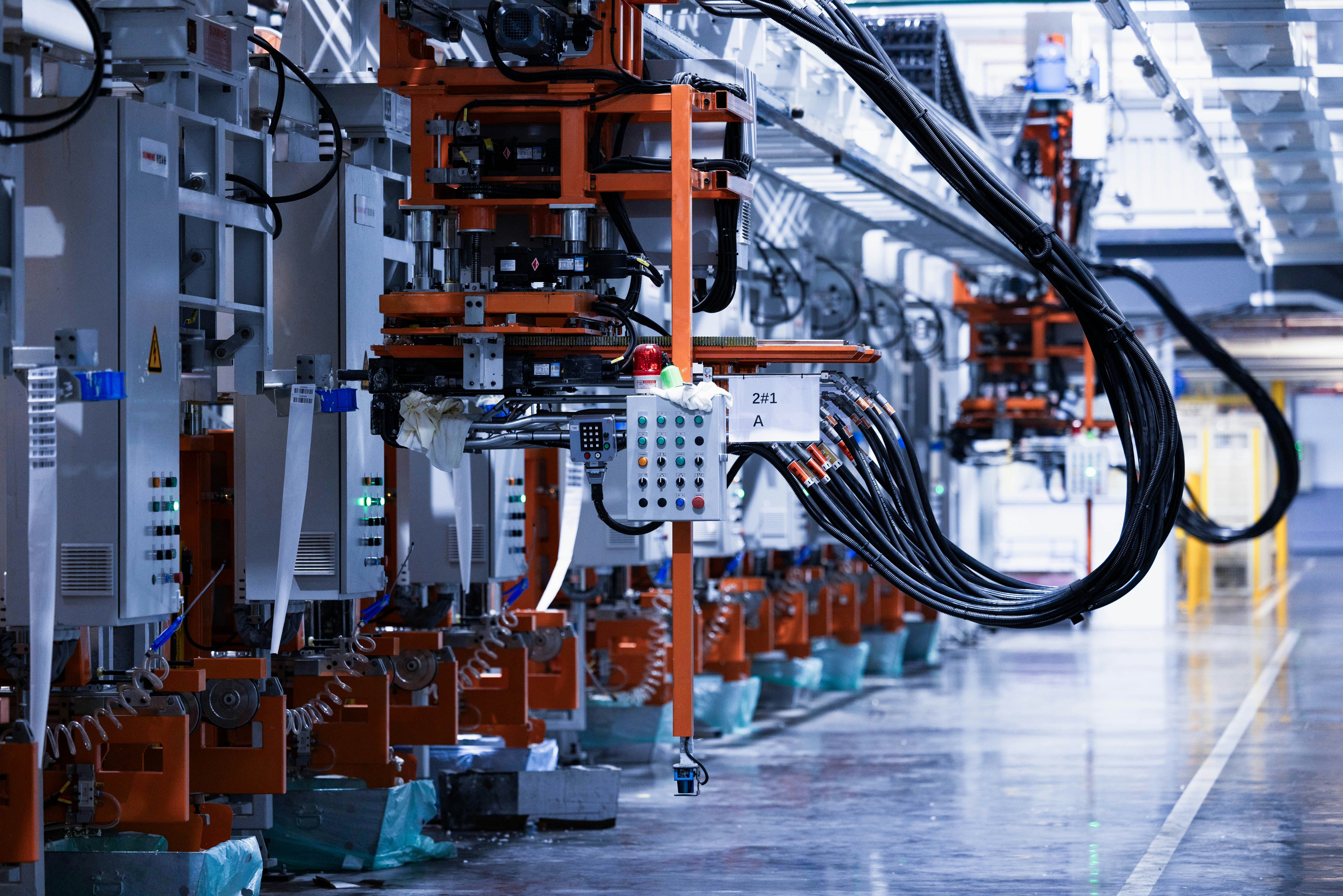 Automated robotic production line with press stations